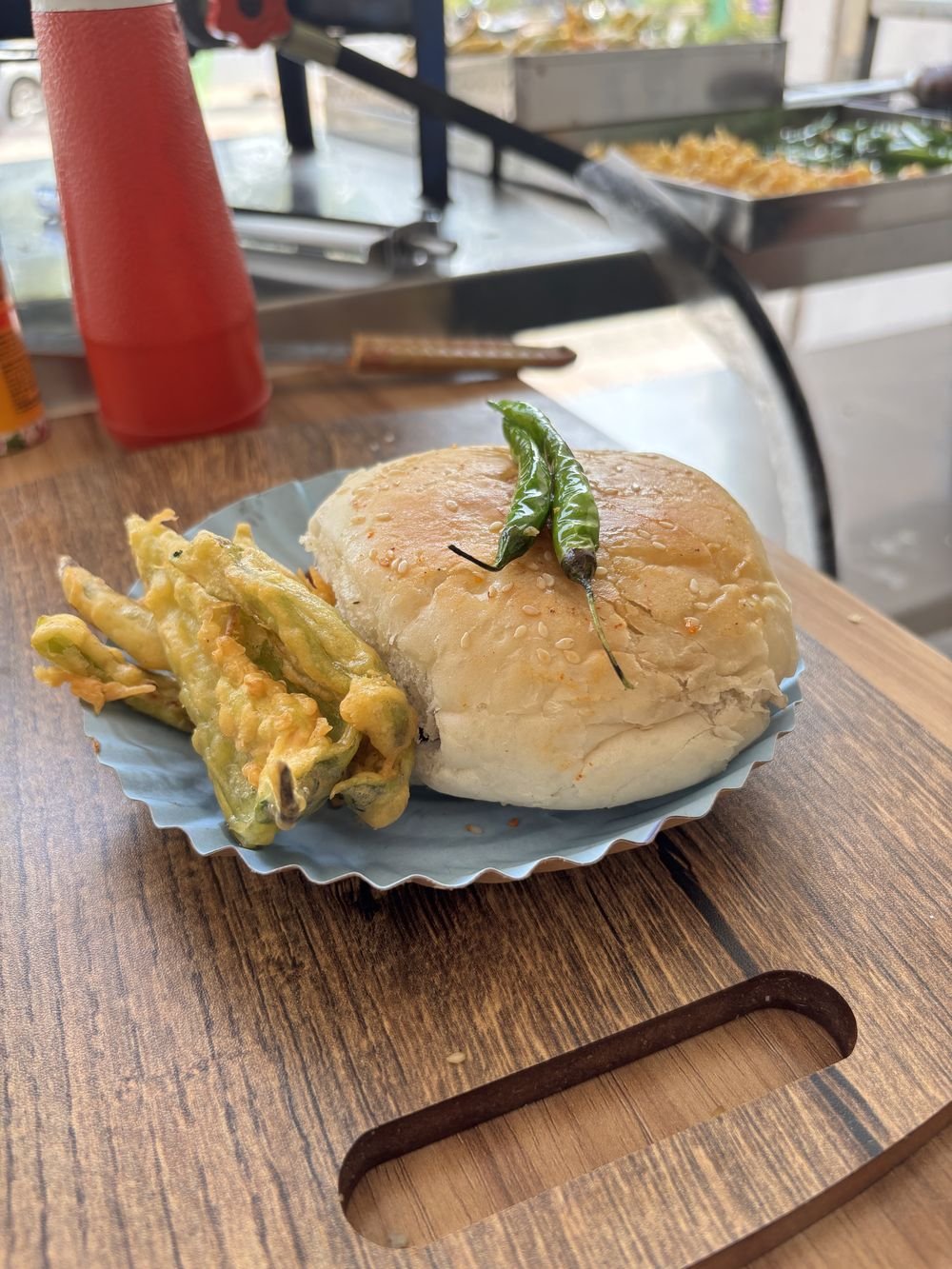 Vadapav served with fried green chillies